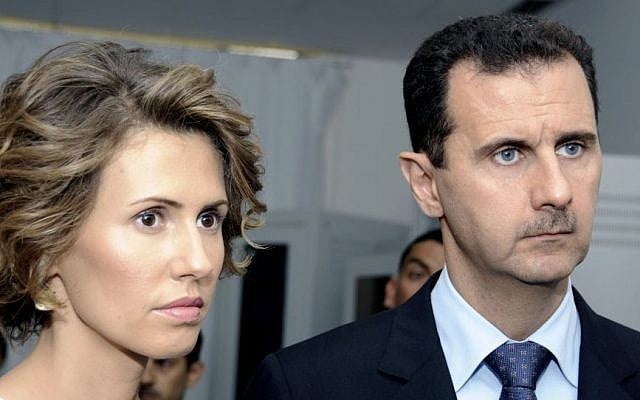 Syrian President Bashar Assad and his wife, Asma Assad, in July 2010. (AP/Hassene Dridi)