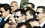 In this June 13, 2000 file photo, Syrian President Bashar Assad, right, his brother Maher, center, and brother-in-law Major General Assef Shawkat, left, stand during the funeral of late president Hafez Assad in Damascus, Syria (photo credit: AP)