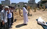 In this citizen journalism image provided by the United media office of Arbeen which has been authenticated based on its contents and other AP reporting, Syrians pray during the funeral of a man killed from a shell in Arbeen town, a suburb of Damascus, Syria, Tuesday, Sept. 3, 2013 (photo credit: AP)
