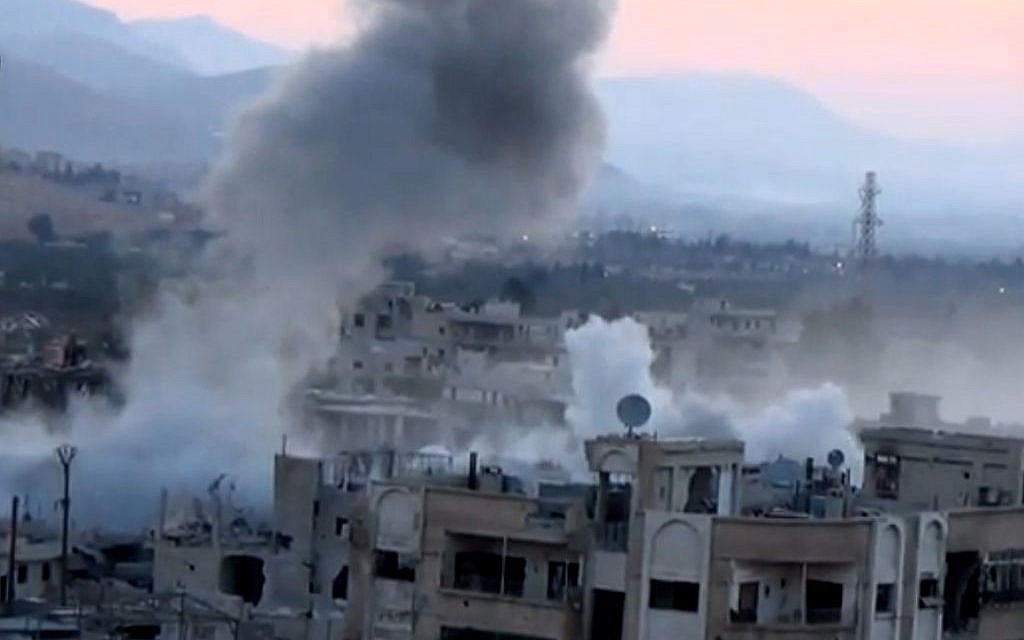 Smoke rises from buildings due to heavy artillery shelling in Barzeh, a district of Damascus, Syria, on Tuesday, September 10, 2013. (AP/Shaam News Network via AP video) Smoke rises from buildings due to heavy artillery shelling in Barzeh, a district of Damascus, Syria, on Tuesday, September 10, 2013. (AP/Shaam News Network via AP video)