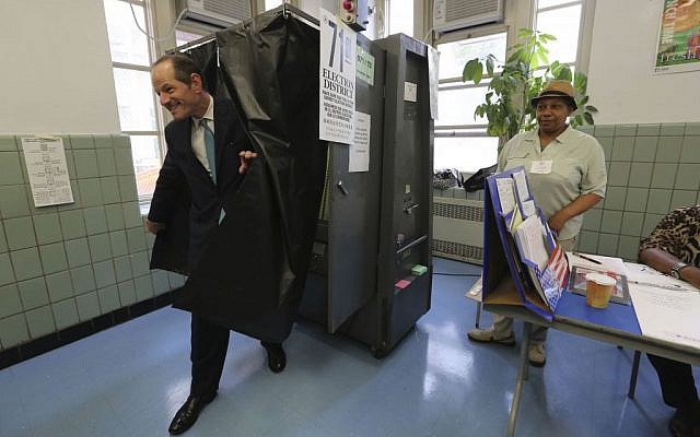 Democratic comptroller hopeful Eliot Spitzer exits the voting booth after casting his vote in the primary election at his polling station in New York, Tuesday, Sept. 10, 2013. (photo credit: AP/Mary Altaffer) Democratic comptroller hopeful Eliot Spitzer exits the voting booth after casting his vote in the primary election at his polling station in New York, Tuesday, Sept. 10, 2013. (photo credit: AP/Mary Altaffer)