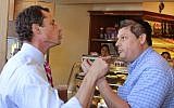 Anthony Weiner, left, who is seeking the Democratic nomination to run for the New York City Mayor’s Office, has a heated argument with Shaul Kessler at Weiss Bakery in the Boro Park neighborhood in the Brooklyn borough of New York, Wednesday, September 4, 2013 (photo credit: AP/Shimon Gifter)