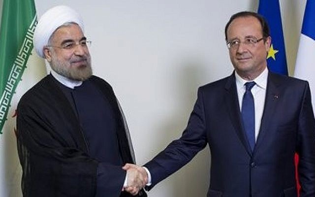 Iranian President Hassan Rouhani, left, shakes hands with French President Francois Hollande during the 68th session of the United Nations General Assembly at UN headquarters last month (photo credit: AP/Craig Ruttle) Iranian President Hassan Rouhani, left, shakes hands with French President Francois Hollande during the 68th session of the United Nations General Assembly at UN headquarters last month (photo credit: AP/Craig Ruttle)