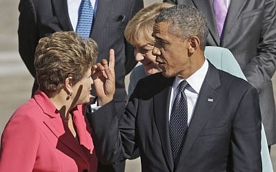 US President Barack Obama with other leaders for the group photo at the G-20 summit at the Konstantin Palace in St. Petersburg, Russia, Friday, Sept. 6, 2013. Greeting each other behind Obama are Brazil's President Dilma Rousseff, left, and Germany's Chancellor Angela Merkel. (Photo credit: AP/Pablo Martinez Monsivais)