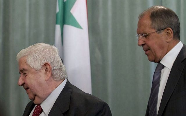 Sergey Lavrov (right) and Walid Moallem (photo credit: Ivan Sekretarev/AP)