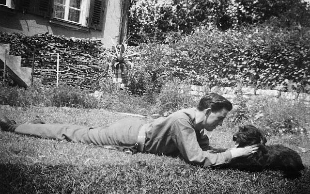 J.D. Salinger plays with his dog, Benny. (photo credit: AP Photo/The Story Factory, Paul Fitzgerald)