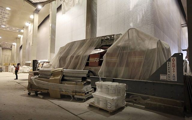 The New York City Fire Department Engine Co. 21 truck is covered in a protective wrap during a media tour of the National September 11 Memorial and Museum, Friday, Sept. 6, 2013 in New York. (photo credit: AP Photo/Mary Altaffer)