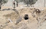 Egyptian army personnel supervise the destruction of tunnels between Egypt and the Gaza Strip at the border, near the town of Rafah, northern Sinai, Egypt, September 2013. (photo credit: AP/AP Television)