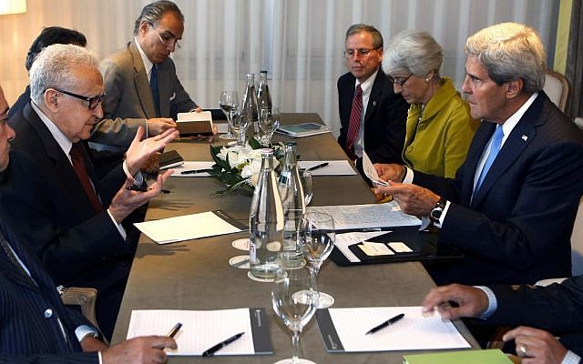 US Secretary of State John Kerry, right, talks with the UN Special Representative for Syria Lakhdar Brahimi, second left, in Geneva, Switzerland on Thursday. (photo credit: AP/Larry Downing, Pool) US Secretary of State John Kerry, right, talks with the UN Special Representative for Syria Lakhdar Brahimi, second left, in Geneva, Switzerland on Thursday. (photo credit: AP/Larry Downing, Pool)