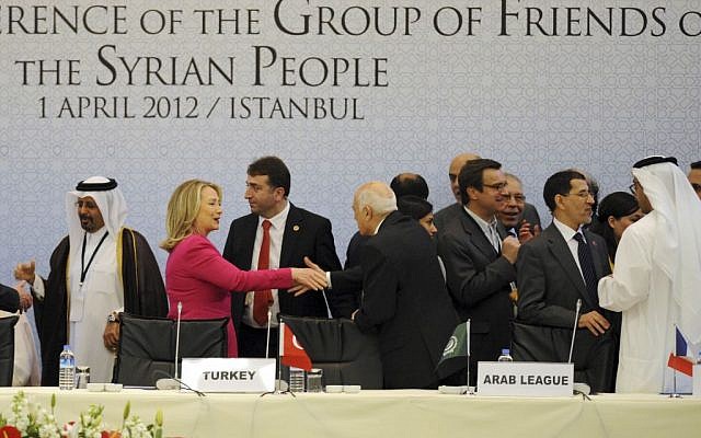 In this April 1, 2012, file photo, then-U.S.Secretary of State Hillary Rodham Clinton speaks with an Arab official as she arrives to join foreign ministers from dozens of countries gathered to set conditions for a new Syria. Clinton believed she secured Russia’s commitment on a path forward in June 2012 with the "Geneva process." Within hours of signing on to the strategy, the U.S. and Russia bickered over whether the agreement included Assad relinquishing power. (photo credit: AP Photo) In this April 1, 2012, file photo, then-U.S.Secretary of State Hillary Rodham Clinton speaks with an Arab official as she arrives to join foreign ministers from dozens of countries gathered to set conditions for a new Syria. Clinton believed she secured Russia’s commitment on a path forward in June 2012 with the "Geneva process." Within hours of signing on to the strategy, the U.S. and Russia bickered over whether the agreement included Assad relinquishing power. (photo credit: AP Photo)
