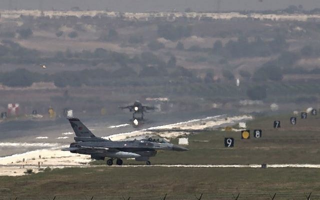A US Air Force plane takes off as a Turkish Air Force fighter jet taxis at the Incirlik airbase, southern Turkey, Sunday, Sept. 1, 2013. (photo credit: AP/Vadim Ghirda) A US Air Force plane takes off as a Turkish Air Force fighter jet taxis at the Incirlik airbase, southern Turkey, Sunday, Sept. 1, 2013. (photo credit: AP/Vadim Ghirda)