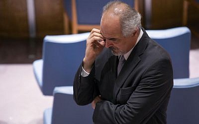 Syrian Ambassador to the United Nations, Bashar Ja'afari, speaks on a phone before a Security Council meeting on the situation in Syria, Friday, Sept. 27, 2013 at U.N. headquarters. (photo credit: AP Photo/Craig Ruttle)