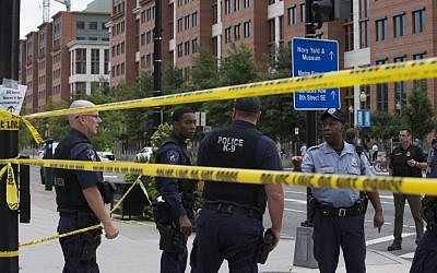 Police work the scene on M Street, SE in Washington near the Washington Navy Yard on Monday, September 16, 2013. (photo credit: AP/Jacquelyn Martin)