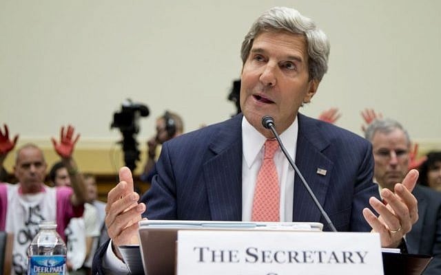 Protesters hold up red painted hands behind US Secretary of State John Kerry as he testifies on Capitol Hill in Washington, Wednesday (photo credit: AP/Carolyn Kaster) Protesters hold up red painted hands behind US Secretary of State John Kerry as he testifies on Capitol Hill in Washington, Wednesday (photo credit: AP/Carolyn Kaster)