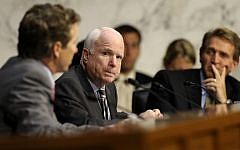 US Senator John McCain, center, listens during a hearing of the Senate Foreign Relations Committee on Capitol Hill, September 4. 2013. (AP/Susan Walsh)