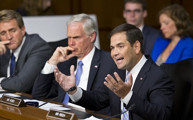 Senate Foreign Relations Committee member Republican Senator Marco Rubio, right, questions Secretary of State John Kerry during a hearing on President Barack Obama's request for congressional authorization for military intervention in Syria, on Tuesday (photo credit: AP/J. Scott Applewhite) Senate Foreign Relations Committee member Republican Senator Marco Rubio, right, questions Secretary of State John Kerry during a hearing on President Barack Obama's request for congressional authorization for military intervention in Syria, on Tuesday (photo credit: AP/J. Scott Applewhite)