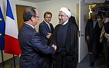 Iranian President Hasan Rouhani, right, meets with French President Francois Hollande during the 68th session of the United Nations General Assembly at United Nations headquarters Tuesday, Sept. 24, 2013 (photo credit: AP/Craig Ruttle)