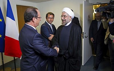 Iranian President Hasan Rouhani, right, meets with French President Francois Hollande during the 68th session of the United Nations General Assembly at United Nations headquarters Tuesday, Sept. 24, 2013 (photo credit: AP/Craig Ruttle)