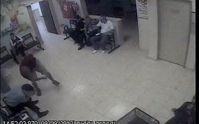 A Jewish man being attacked in a health clinic in Kfar I'blin, September 2013. (screen capture: Youtube/jonatan urich)