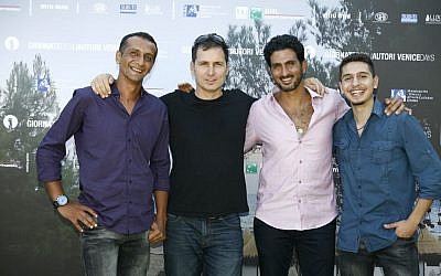 Yuval Adler, second from left, with cast members Hiatham Omari, Tsahi Halevy and Shadi Mar'i at the Venice Film Festival (Photo credit: Moris Puccio/ Courtesy)