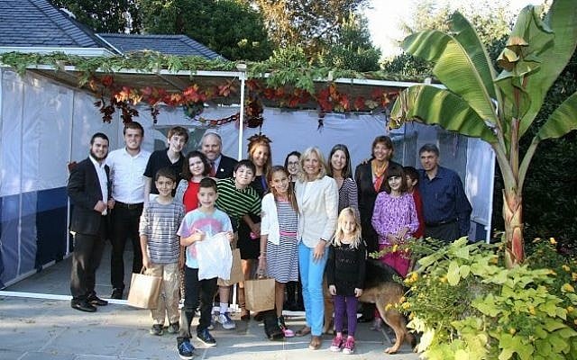 Former vice president Joe Biden's wife, Dr. Jill Biden (center right) with the group of invited sukkah builders and decorators at the Vice President's official residence in Washington, DC, in 2013. (photo credit: Victor Mizrahi) Former vice president Joe Biden's wife, Dr. Jill Biden (center right) with the group of invited sukkah builders and decorators at the Vice President's official residence in Washington, DC, in 2013. (photo credit: Victor Mizrahi)