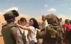 French diplomat Marion Fesneau-Castaing pushing an IDF soldier during the September incident. (Screenshot/YouTube)