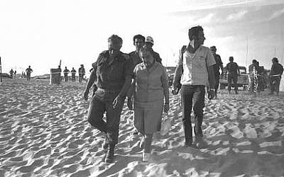 Prime minister Golda Meir touring the southern front with Maj. Gen. Ariel Sharon several days after the 1973 Yom Kippur War (Yehuda Tzion/ GPO)