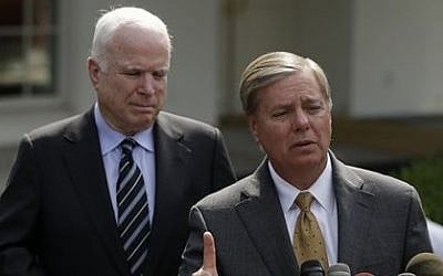 Senator Lindsey Graham, right, accompanied by Senator John McCain, speaks with reporters outside the White House in Washington, D.C., in September 2013. (photo credit: AP/Pablo Martinez Monsivais) Senator Lindsey Graham, right, accompanied by Senator John McCain, speaks with reporters outside the White House in Washington, D.C., in September 2013. (photo credit: AP/Pablo Martinez Monsivais)