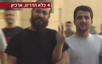 Archive footage: Nur al-Din Amar, brother of Nidal Amar, flashes a victory sign at the camera. (photo credit: screen capture, Channel 2)