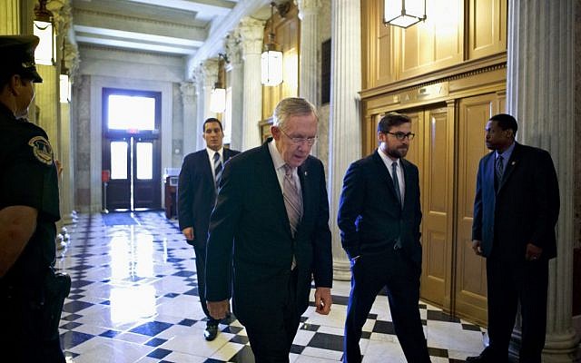 Senate Majority Leader Harry Reid of Nevada makes his way to the Senate floor on Capitol Hill in Washington in September. (photo credit: AP/J. Scott Applewhite) Senate Majority Leader Harry Reid of Nevada makes his way to the Senate floor on Capitol Hill in Washington in September. (photo credit: AP/J. Scott Applewhite)