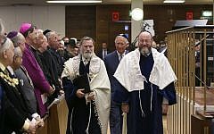 Outgoing chief rabbi Jonathan Sacks (left), walking with Ephraim Mirvis (right) and Prince Charles (behind them in center). (photo credit: Yakir Zur)