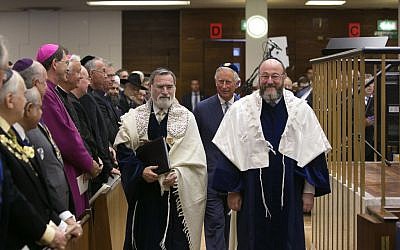 Outgoing chief rabbi Jonathan Sacks (left), walking with Ephraim Mirvis (right) and Prince Charles (behind them in center). (photo credit: Yakir Zur)