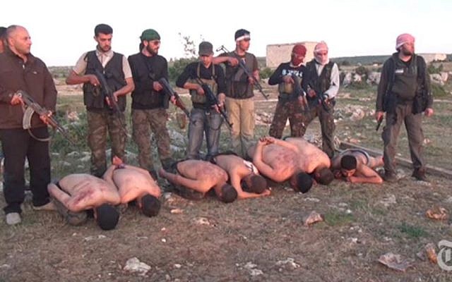 A video released by the New York Times shows Syrian rebels about to execute stripped and bound soldiers loyal to President Bashar Assad (photo credit: @MmeLenvie via Twitter/File) A video released by the New York Times shows Syrian rebels about to execute stripped and bound soldiers loyal to President Bashar Assad (photo credit: @MmeLenvie via Twitter/File)