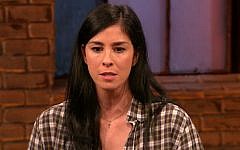 Sarah Silverman wears a necklace with a cross during a recent interview (via YouTube)