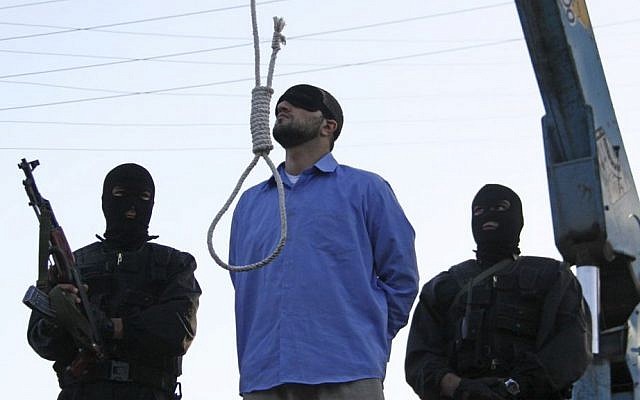 File: A blindfolded man waits to be hanged in public as two police officers look on in Shiraz, Iran, April 16, 2011. (AP/Mehr News Agency/Mohammad Hadi Khosravi) File: A blindfolded man waits to be hanged in public as two police officers look on in Shiraz, Iran, April 16, 2011. (AP/Mehr News Agency/Mohammad Hadi Khosravi)