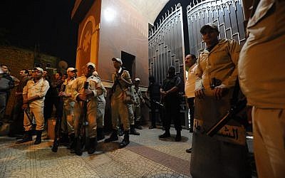 Illustrative photo of Egyptian security forces standing guard at a Coptic Christian church, October 20, 2013 (photo credit: AP/Amr Mohsen)