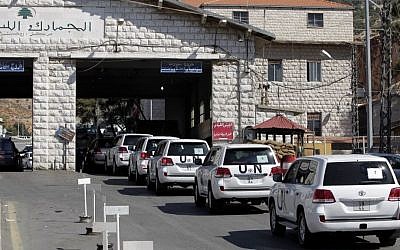 A convoy of inspectors from the Organization for the Prohibition of Chemical Weapons prepares to cross into Syria at the Lebanese border crossing point of Masnaa, eastern Bekaa Valley, Lebanon, on Tuesday, October 1, 2013. (photo credit: AP/Bilal Hussein)