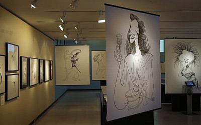 Drawings by Al Hirschfeld are displayed in an exhibit on the artist at the Library for the Performing Arts in New York, Wednesday, Oct. 16, 2013. (photo credit: AP Photo/Seth Wenig)
