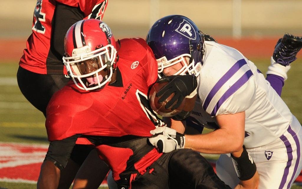 Avi Rosenblum playing football for Albany High School. (photo credit: Ned Purdom/ Courtesy of Rom Rosenblum) Avi Rosenblum playing football for Albany High School. (photo credit: Ned Purdom/ Courtesy of Rom Rosenblum)