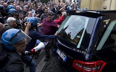 Rioters greet the hearse carrying the body of Nazi war criminal Erich Priebke in Rome, Italy, on Tuesday (photo credit: @GalvaniM via Twitter)