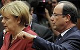 French President Francois Hollande (right), speaks with German Chancellor Angela Merkel as they arrive for a roundtable meeting at an EU summit on Thursday, October 24, 2013. (photo credit: AP/Yves Logghe)