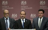 Members of the Syrian Opposition Coalition, including the group's President Ahmed Jarba, center, Heitham Al-Maleh, left, and Salem Al-Muslit speak to the media at the British Foreign Office in London Tuesday, Oct. 22, 2013 (photo credit: AP/Alastair Grant)