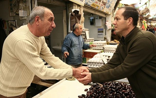 Nir Barkat  with a vendor at Mahane Yahuda market, December, 2007 (photo credit: Nati Shohat/Flash90)