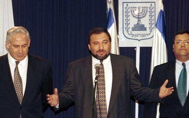 Then-director-general of the Prime Minister's Office Avigdor Lieberman, center, with Benjamin Netanyahu and Moshe Lion (right), December 25, 1996. (photo credit: Flash90)