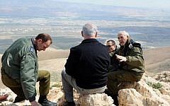 Prime Minister Benjamin Netanyahu (back to camera), visiting the Jordan Valley in 2011. (Moshe Milner/GPO/Flash90)