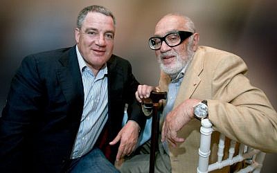 A portrait of the late Sammy Ofer with his son, Idan Ofer. (Moshe Shai/Flash90)