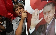Palestinian students hold up pictures of Turkish Prime Minister Recep Tayyip Erdogan as they wave the Turkish and Palestinian flags during a rally in Gaza, in 2011 (photo credit: Abed Rahim Khatib/Flash90)