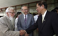 Hebrew University President Professor Menachem Ben-Sasson, center, looks on as Nobel Prize winner Robert Aumann, left, greets Nobel Prize winner Yuan T Lee at an international science event held at the Hebrew University in Jerusalem, August 2012 (Photo credit: Miriam Alster/Flash90/File)