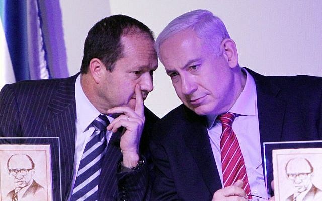 Benjamin Netanyahu speaks with Nir Barkat at an award winning ceremony in Jerusalem, December 11, 2012. (photo credit: Miriam Alster/Flash90)