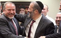 Yisrael Beytenu head Avigdor Liberman (left) and Shas leader Aryeh Deri at a celebration in honor of Deri's birthday, in the Knesset, February 18, 2013. (photo credit: Flash90)